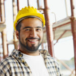portrait of latin american construction worker, looking at camera